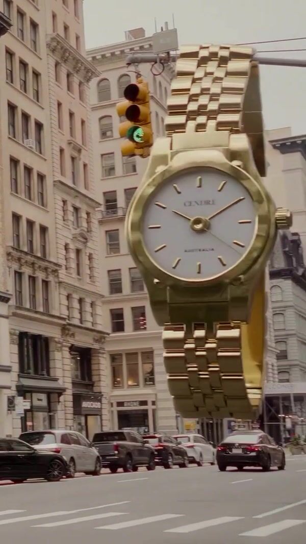 Cendré Watch Hanging Over Traffic Light on Street