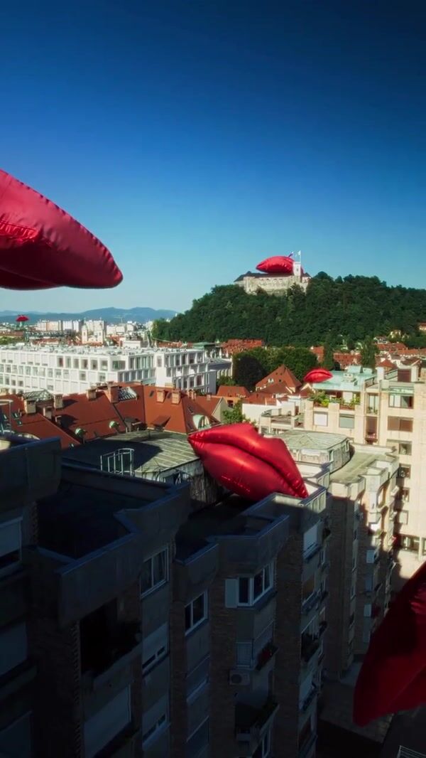 Smile Inflatable Lips Resting Above Castle