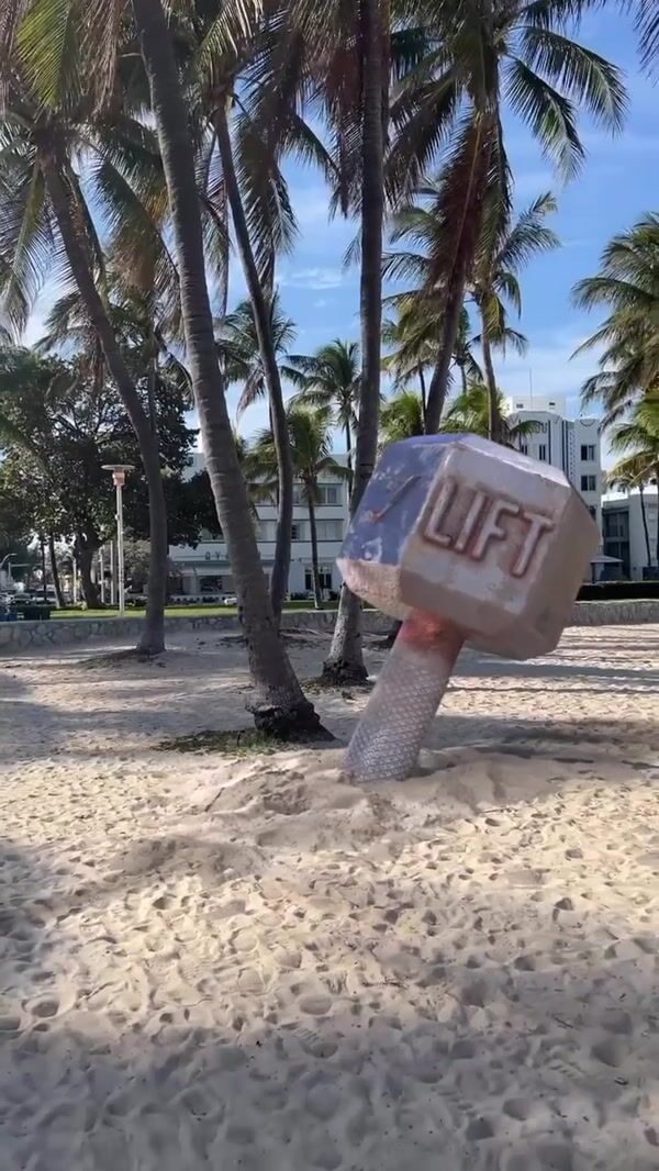 Gymshark Giant Dumbbell on Sand