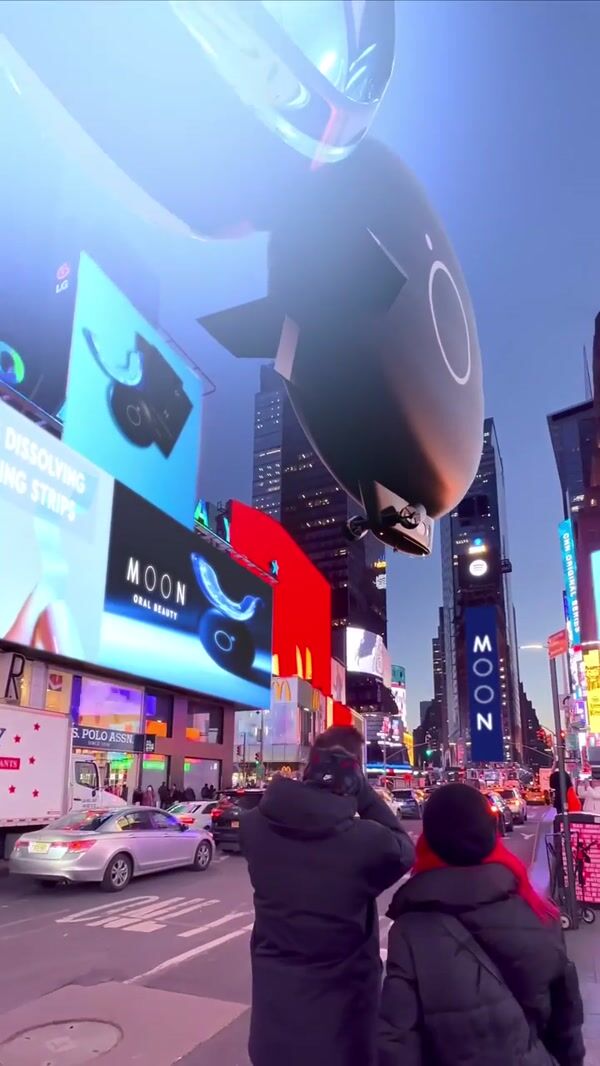 MOON Teeth Whitening Device Flying in Times Square
