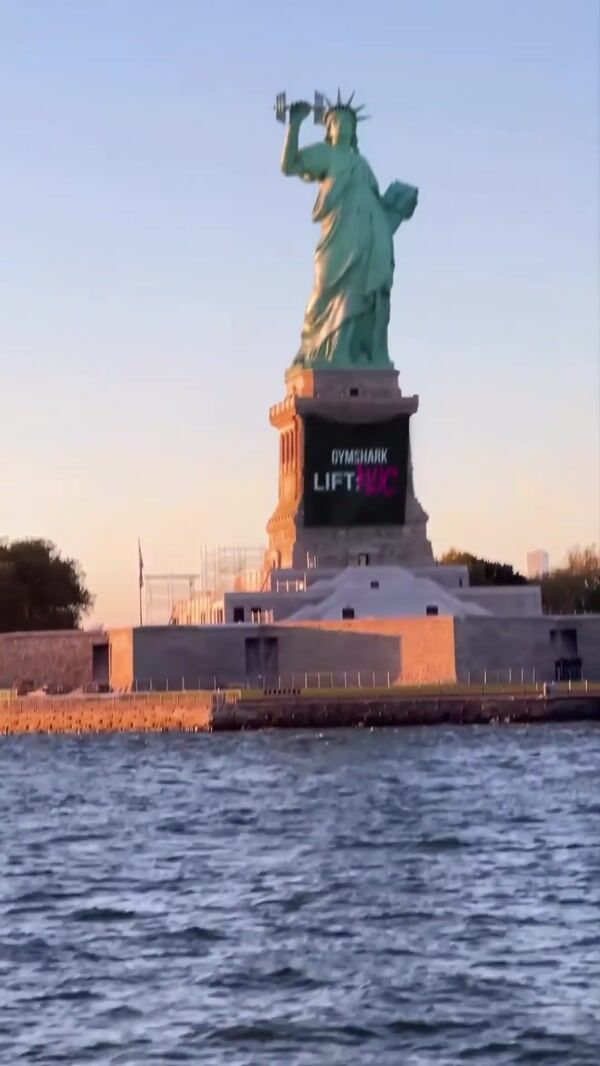 Gymshark Statue of Liberty Lifts Dumbbells
