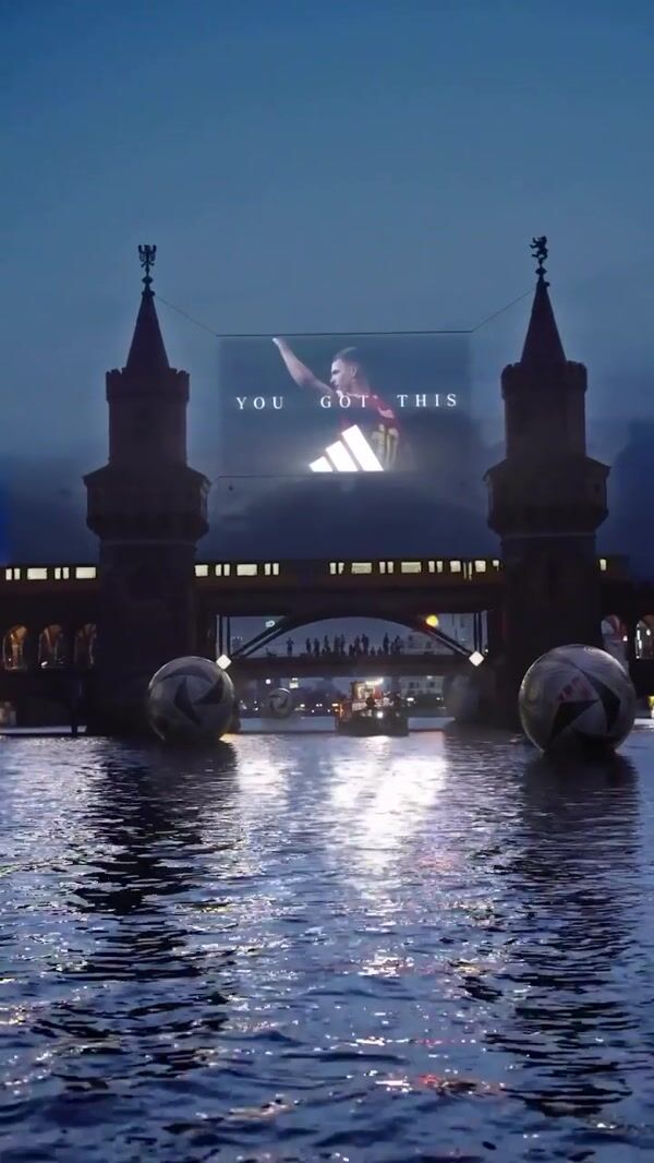 Adidas Hanging Screen Above Spree River
