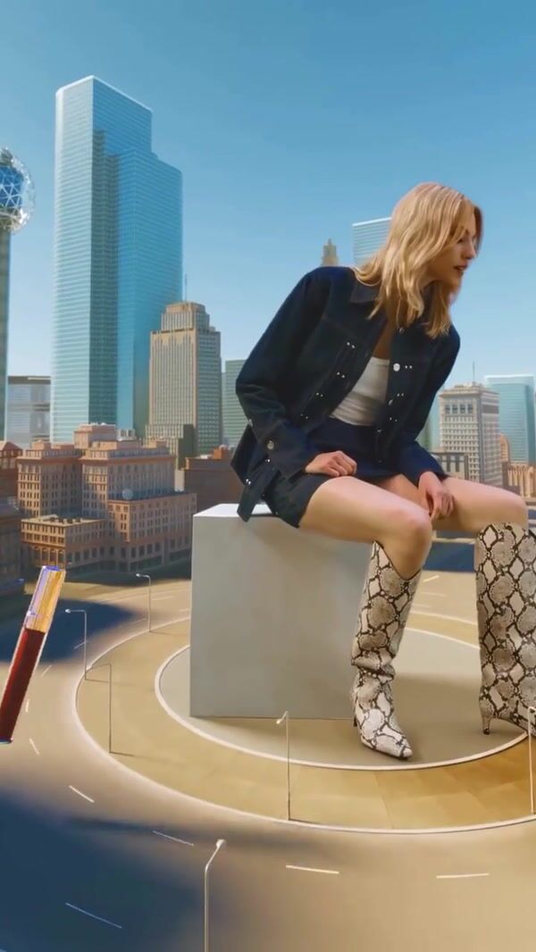 Shopbop Woman Surrounded by Fashion Carousel